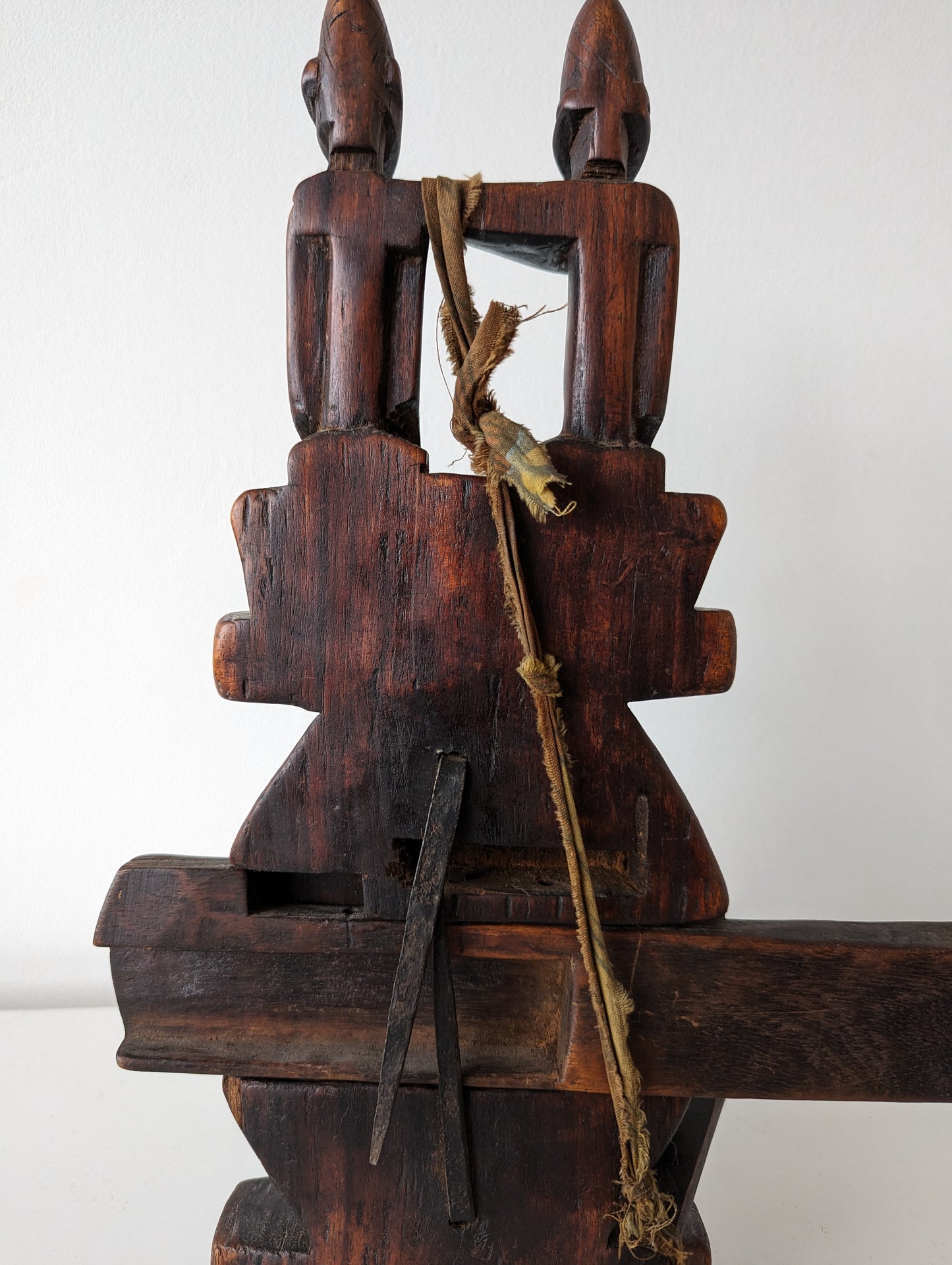 A side profile of the lock with the key inserted, showing the key's shape and the profile of the carvings.