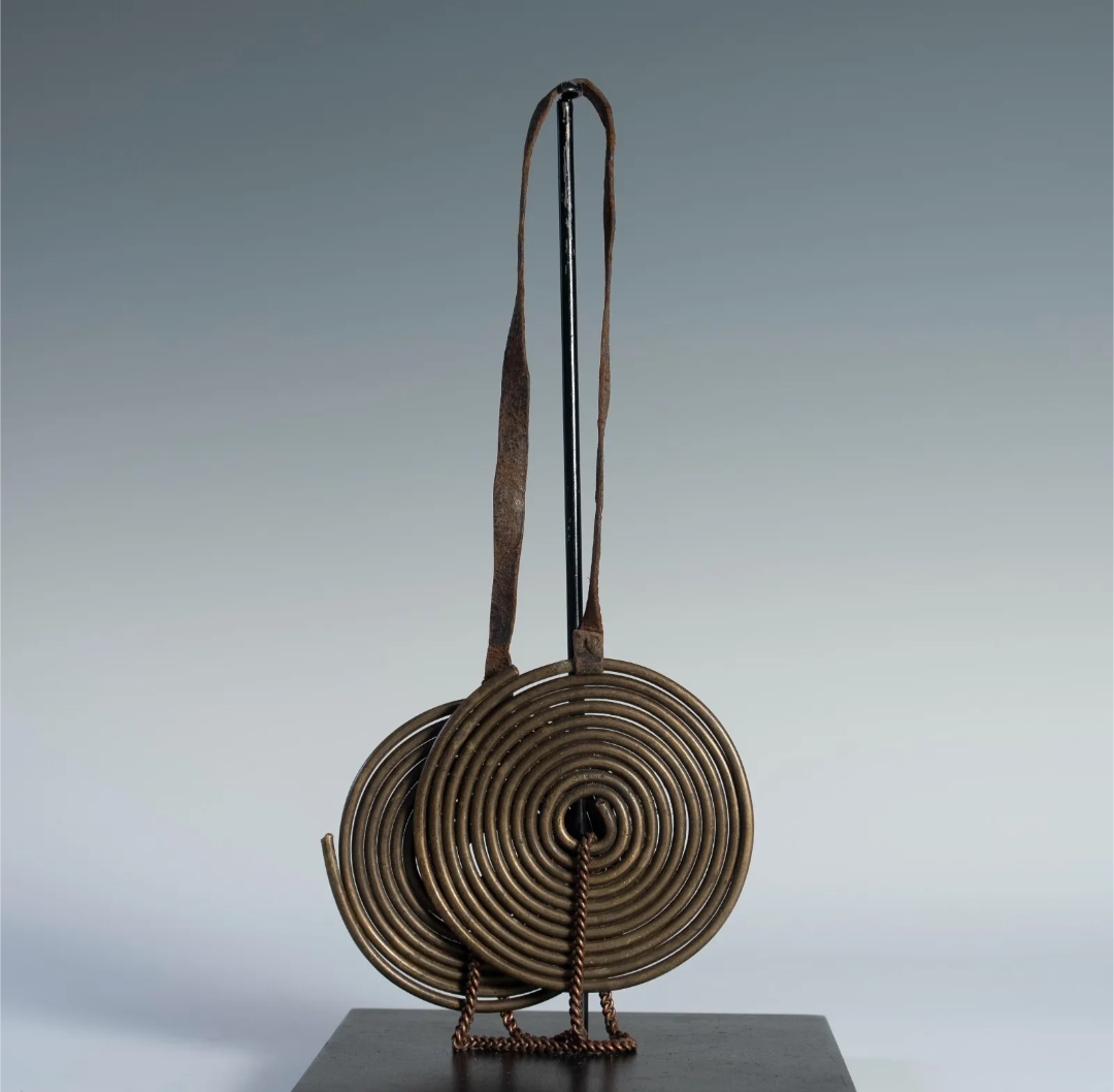Front view of the full Maasai neck adornment on a display stand, showing the complete piece and its overall shape