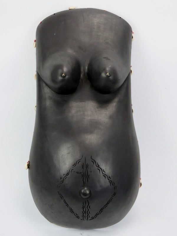 Njorowe or Ndimu Makonde carved and ebonised wood pregnant female breast and stomach plate