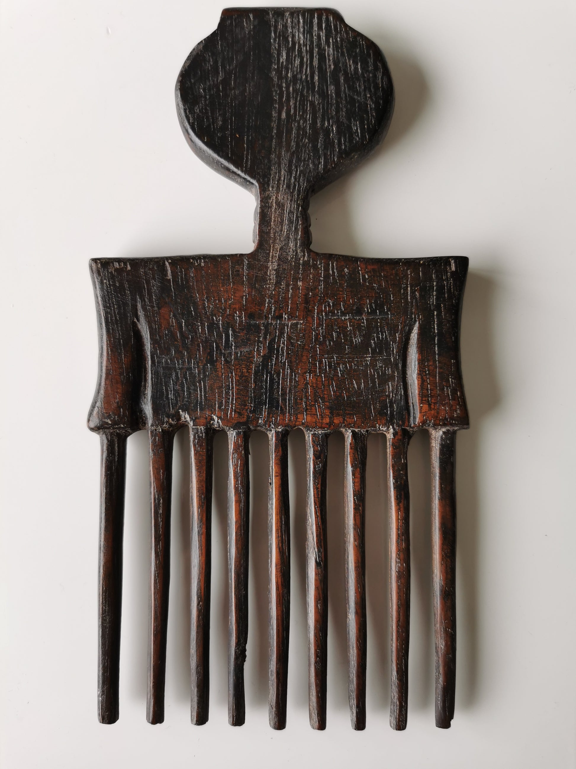 Back view of an Antique Ashanti Hair Comb